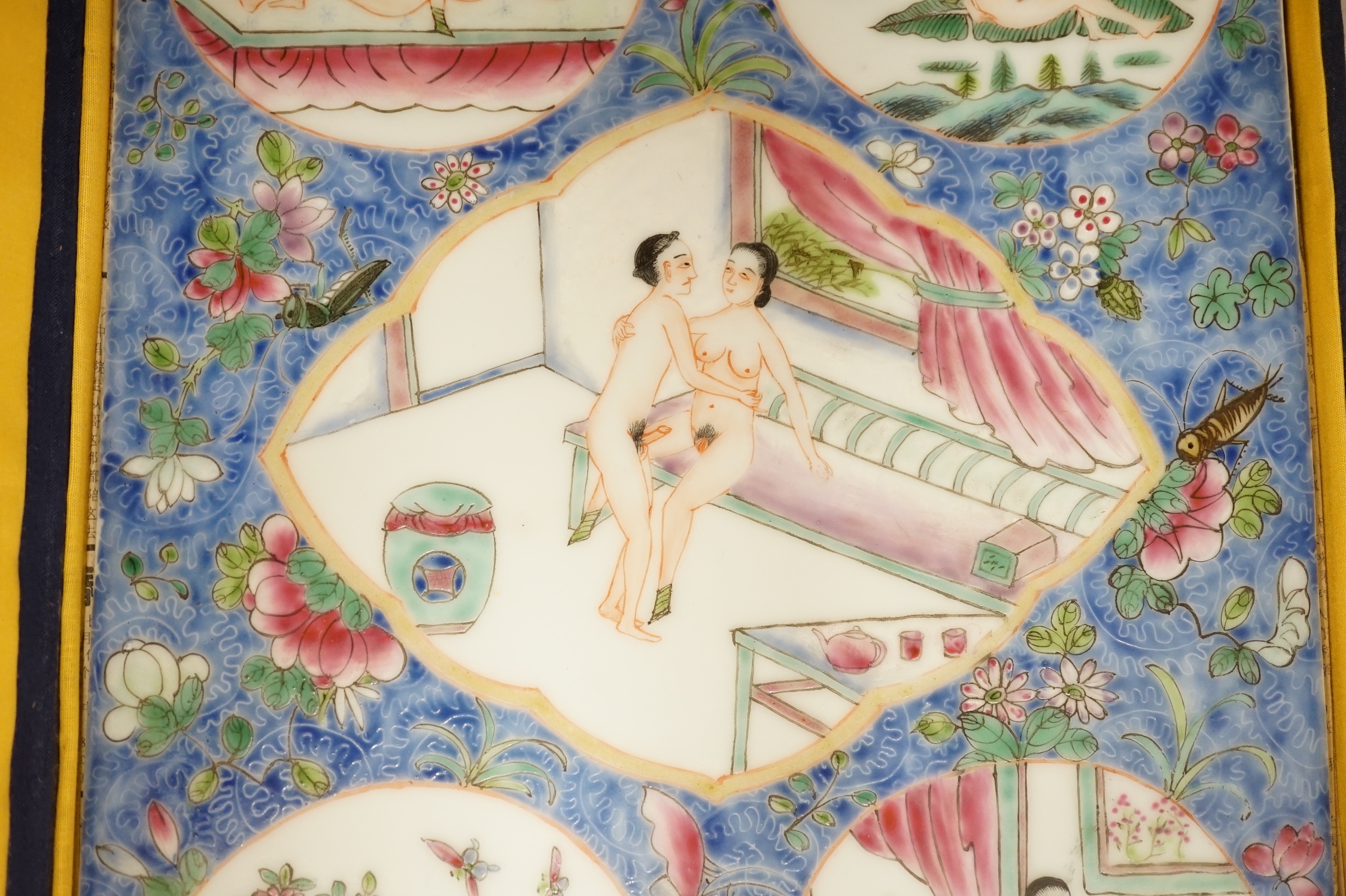 A cased Chinese enamelled porcelain erotic tile, 25cm wide, 36.5cm high